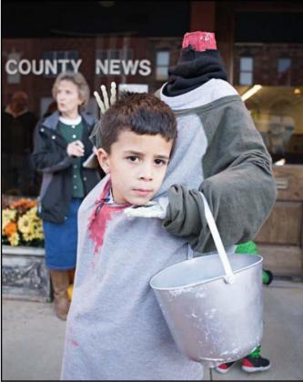 Alex Bruton, above, attended the Downtown Trick or Treat event last year. Photo/Brian Blansett.