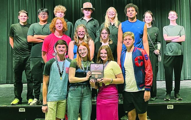 Junior Ian Radcliffe and seniors Emerson Snovel and Anna Phillips (left) pose with their All-Star Cast medallions after the OSSAA 4A Regional One Act competition. The rest of the cast and crew of “Anna and August” join them (right) with their third-place plaque. They went on to compete at the state competition on Oct. 26 in Mustang but didn’t place. Photos/Emily Kalka