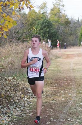 Meeker sophomore Riley Randall had almost a 30-second lead for the second half of the Class 3A state championship cross country meet Wednesday. Above, he runs by himself during the back stretch. Photo/Brian Blansett