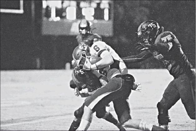Stroud quarterback Grant Elerick (6) pounds for extra yardage against Konawa. Photo/Tommie Marshall