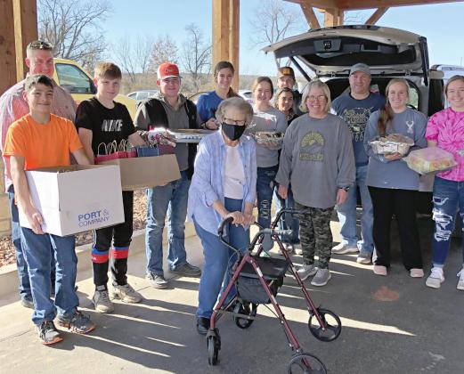Members of the Deer Creek Baptist Church youth group delivering lunch to Prairie Pointe on Monday.