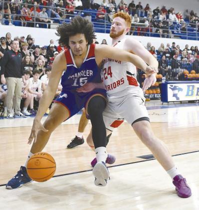 Chandler senior Zalen Smith (15) makes a physical move in the lane against Washington’s Teagen Foster (24) during the regional finals at Bethel Saturday night. Photo/Brian Blansett