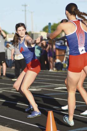 Chandler’s Hilgenfeld sisters had a strong day Saturday at the Class 3A regional in Chandler. Freshman Elli, left, won the 100-meter hurdles with a time of 16.8 and senior Cali, right, shown taking the stick from Elli in the 4x400 meter relay, won the 100-meter dash with a time of 12.53. They teamed with sophomore Brooklyn Hammons and junior Lexi Martzall to win the 4x100 meter relay. Photos/Brian Blansett