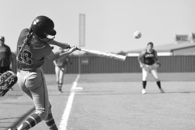 Chandler’s Hadlee Massengale slugs a three-run double against Seminole in August. The Lady Lions won this game, then went to Okemah and won the 66 Conference Tournament championhip. Photo/Brian Blansett