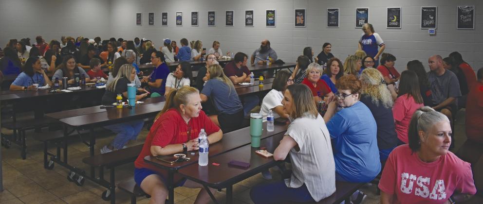 Teachers and staff from East Side Elementary, Park Road Elementary, Chandler Junior High and Chandler High School gather in the cafeteria at Park Road on August 13 for the Back to School Appreciation Breakfast hosted by the Chandler Area Chamber of Commerce. Not only did they all receive a free breakfast, but they also were entered into a drawing for door prizes. Photo/Emily Kalka