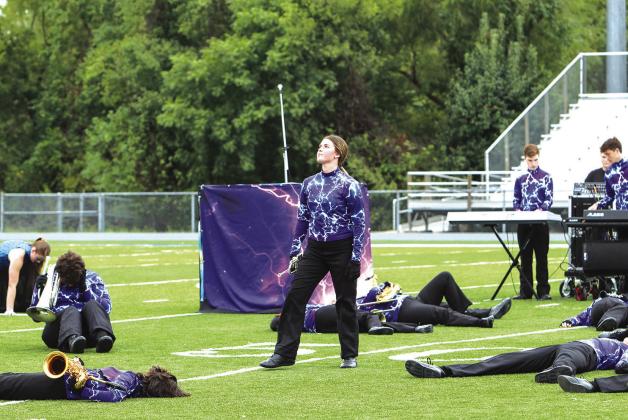 Senior LaurenAylward from Chandler stands in the middle of the field during prelims at the Blue and Grey Marching Band Classic on Oct. 3 in Glenpool. Photo/Jennifer Pryor