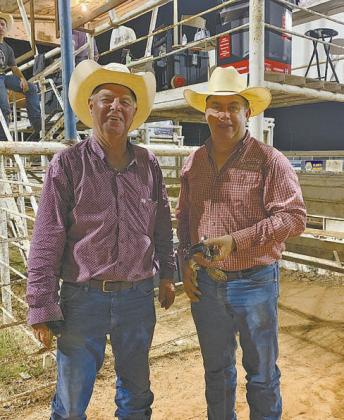 Justin Harrell, right, was the winner of the custom spurs by Kirby Wanger. He is pictured with Chandler Rodeo Marty Hall. Photo/provided