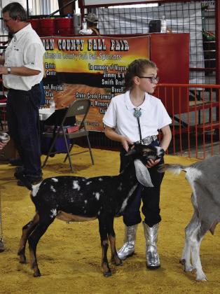 Aurora Little stands and waits for the judge to approach her and her Nubian goat during the Junior Dairy Goat Show. She won Reserve Champion for the breed on Aug. 23 at the Lincoln County Fair. Photo/Emily Kalka