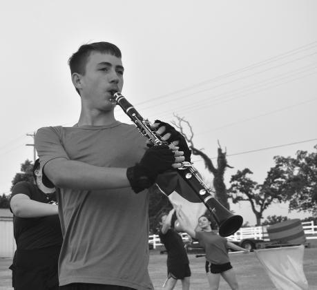 (Top) The Pride of Chandler shows off their marching in a preview event held for friends and family on August 9 to wrap up their two-week camp. They later brought up friends and family to learn Lower left, (from left to right) Lily Milam, JD Simpson, Logan White, Hunter Stewart and Laura Dollarhite perform the first part of this year’s half-time show “The Raven,” along with Kade Lambert in the photo on the right. Photo/Emily Kalka