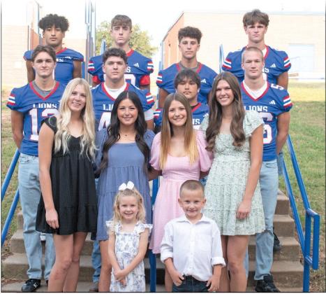 The candidates and escorts for Chandler’s homecoming court pose in front of the Media Center on Monday. They are, Back Row: Javarious Wade, Maddox Metheny, Bryson Taylor, Coniah Ritchie; Middle Row: Clayton Ritchie, Sam Hall, Tallan Boggs, Brody Waldman; Front Row: Blaklei Smith, Kennedy Allen, Jaycee Cross, Elli Hilgenfeld; Kids: Kimber Byus and Cruz Wunderlich. The coronation will be 6 p.m. Friday before the football game against Clinton. Photo/Emily Kalka