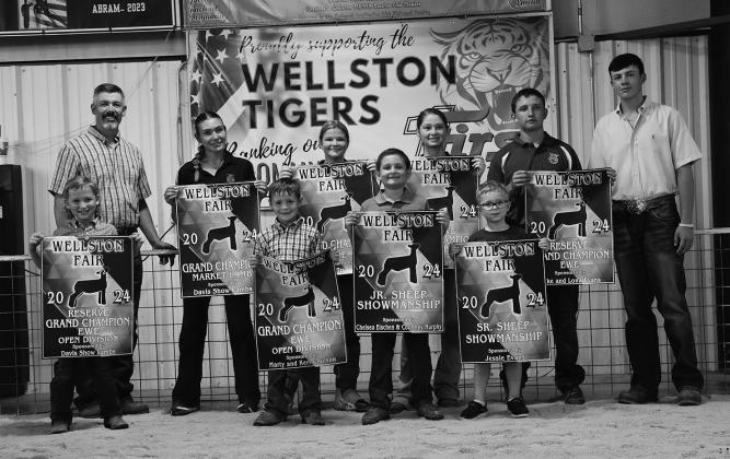 Sheep: The winners of the Sheep Show at the Wellston Fair Livestock Show. Back row: (left to right) Savanah Gaylord, Brooklynn Estes, Rian Harris and Jett Golightly. Front row: (left to right) Wytt Golightly, Ridge Priddy, Wyatt Jordan, Maverick Hand. Photo/Caylyn Cunningham
