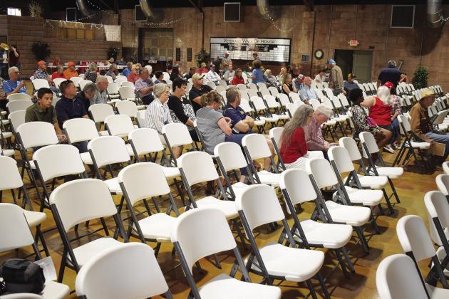 Lincoln County residents listen as Thomas Holmes and others speak at a countywide meeting on June 11 at the Route 66 Interpretative Center, presenting information on wind farm projects in the area. Holmes spoke about the land agreements, while others spoke about the effect of turbines on wildlife, insurance coverage regarding turbines, the effect on weather radars, and other topics. Photo/ Emily Kalka
