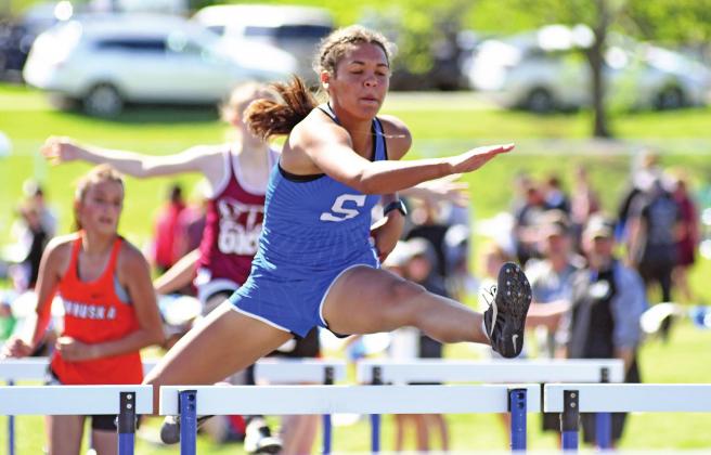 Kileigh Mixon of Stroud was the model of competitive relaxation during the 100 meter hurdles final at the Class 2A regional track meet Saturday in Stroud. She turned in a time of 16.40, which was the best qualifying time in the state. She will be one of a large group of area high school athletes competing in the state track meets Saturday. Photo/Brian Blansett
