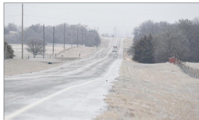 ___ Traffic slowly negotiates state Highway 18 south of Chandler Monday morning. Although traffic slowly increased throughout the day vehicles were few and far between during the morning. Photo/Brian Blansett
