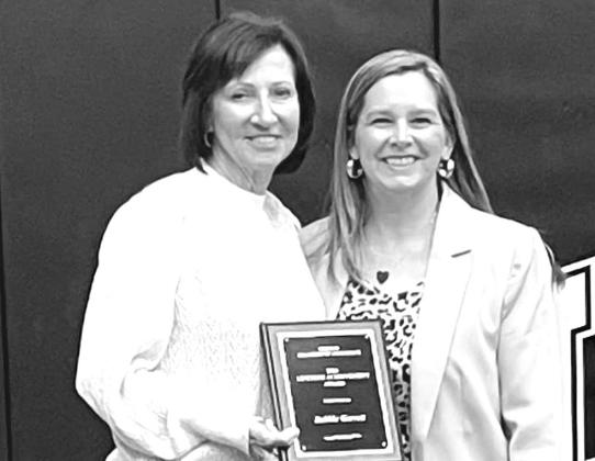 Chamber President Erin Bradley (right) presents the Lifetime Achievement Award to Debbie Garrett (left). Photo/Stroud Chamber of Commerce