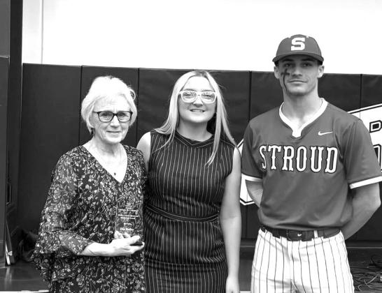 The Mickey Gaines Menorty Award is presented to Dee Baker (far left) by junior members Sage Hightower (middle) and Dylan Baker. Photo/Stroud Chamber of Commerce