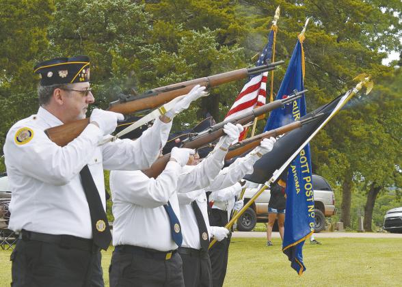 the honor guard firing party salutes the fallen at ceremonies on Monday. Photo/Emily Kalka.