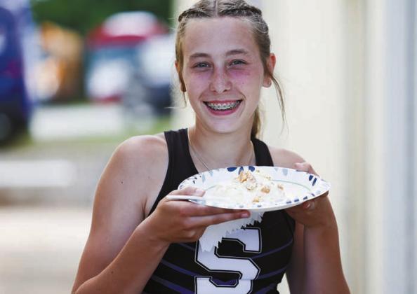 Stroud freshman Sophie Young won the high jump at the Class 2A regional in Stroud with a jump of 5 feet, 4 inches, beating the second place jump by eight inches. Photo/Brian Blansett. She had an extra incentive, too - a promise by coach Kelly Brown that she could have some of the coach’s legendary homemade banana pudding if she broke 5 feet, 2 inches. Right, it made for a nice post-meet snack. Photo/ Beth Young
