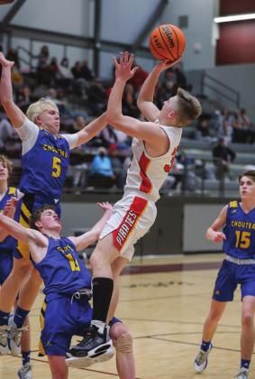 Dale’s Dayton Forsythe shoots over some double-decker defense against Choteau-Mazie. Photo/Rick Hester.