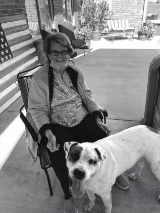 Resident Keturah Brown greets Buddy Hodgens, the only visitor allowed at Prairie Pointe without a mask. Photo/submitted.