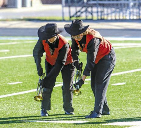 Anna Schlegel (right) and Charleigh Cole (left) perform with The Pride of Chandler during OSSAA Northeast Regionals on Oct. 21 in Oolagah. The marching band received an “Excellent” rating. Photo/Jennifer Pryor.