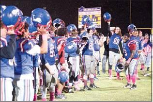 Below, the Lions enjoy the victory. Photos/ Brian Blansett