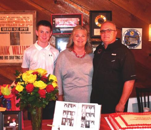 Pictured above, Charlie Dickinson, right, stand with his wife Jeanna, middle, and son Cade, left. Photo/submitted.