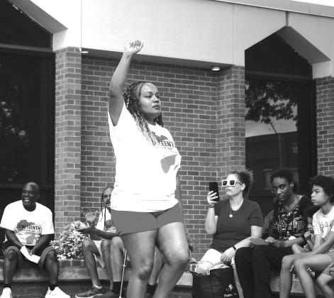 On the left, Minister Sheila Thomas performs a poetry dance during Chandler’s Juneteeth celebration on Saturday, June 20 on the courthouse lane. On the right, Rachelle Thompson performs with a group. Photos/Emily Kalka