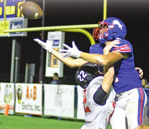 Chandler’s Drake Rodriguez (1) fights through contact to try to take a ball in the end zone late in the game Friday night. The Crossings defender was flagged for pass interference, setting up the Lions with a first and goal that they converted into the winning touchdown. Photo/Brian Blansett