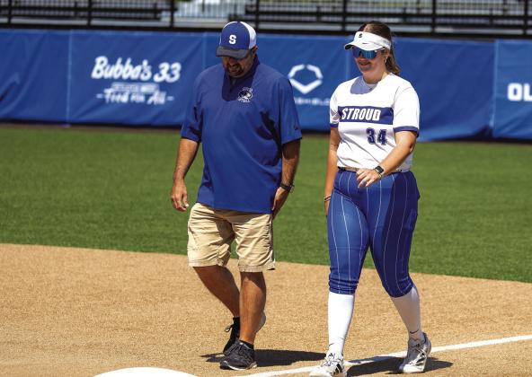 Kamden Bray and Coach Charles Durrence walk out during pregame player intros. Photo/Rick Hester