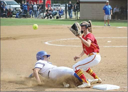 Lady Tiger Emma Davis slides into third while Dale third baseman Danyn Lang waits on the throw. Photo/Rick Hester