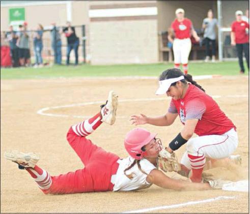Demi Manning takes a tag to the face that resulted in a bloody nose and a headache. She was ruled safe due to the Sulphur third baseman blocking the bag. Photo/Brian Blansett