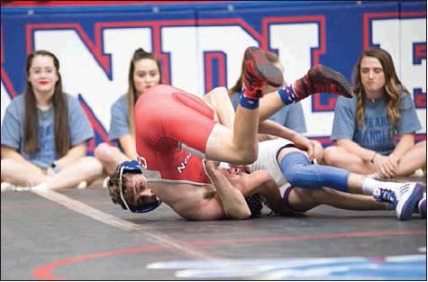 above right, at 113 pounds. Ranked No. 14, the Lions wrestle in Pawnee on Thursday. Photos/Brian Blansett