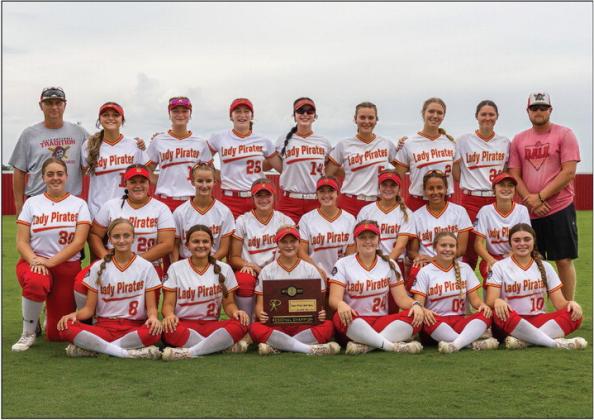 Above, Dale’s Lady Pirates pose with their regional championship trophy. Photo/Rick Hester. Below left, Peyton Davis rounds third in Stroud’s game against Prague last week prior to the regional tournaments. Below right, Prague’s Liyah Daumann awaits a pitch against Stroud.. Photos/Mario Holland