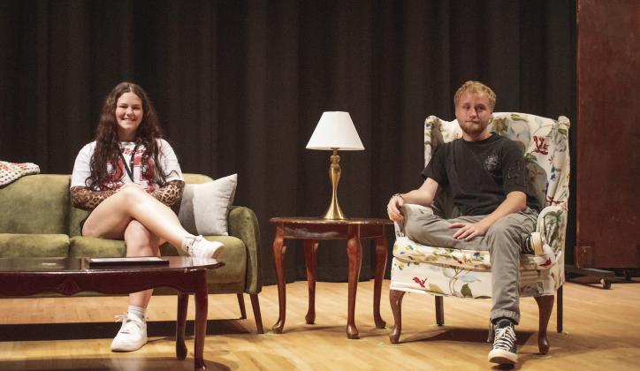 Above, from left to right, James Kerr, Weston Miller, Bethany Descher, Cabella Reno, Zayli Jackson and Hannah Davis performed during the preview of Chandler High School’s one-act “In Darkness, Audio Flowers Bloom” by Alvaro Saar Rios. Below, Averee Haney and Braydon White sit on the set of “The Door,” by Paul Elliott. The play tells the story of a grandmother coming to terms with the murder of her grandson. Photos/Emily Kalka