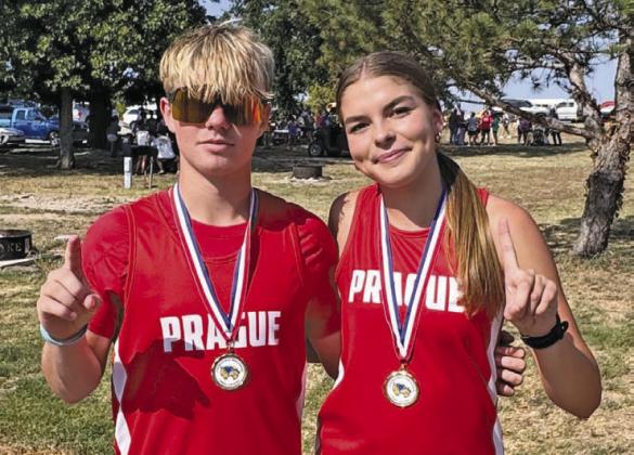 Landon Hubert and Hailey Johnson, individual winners at the Wolverine Invitational cross country meet. Photo/Monica Johnson