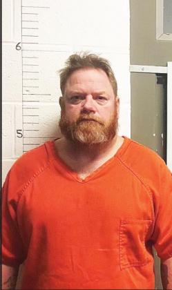 Four charged in homicide