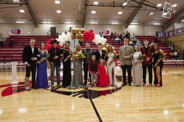 Prague and Dale had their homecomings last week. Above, Blestin Miller escorts Prague’s homecoming queen, Lillie Johnson, off the court. Photo/Robyn Miller. Below is Dale queen Chayse Carem with the Pirates’ homecoming court. Photo/Rick Hester