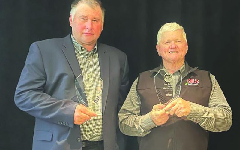 Matt Dornan accepts his awards for wheat he grows near Carney. Photo/Matt Dornana
