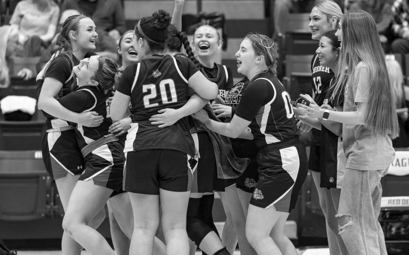 The Meeker girls celebrate after beating Prague, 42-40, last week. Photo/Rick Hester
