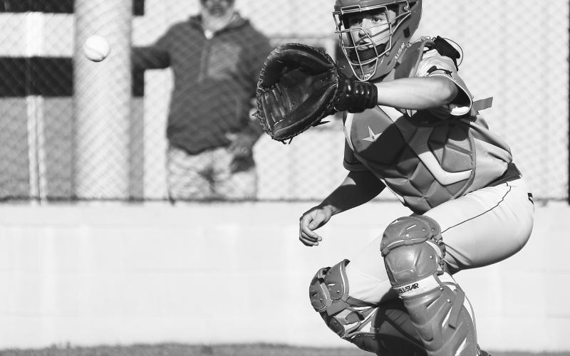 Chandler catcher Sawyer Sims takes a throw for a forceout at home against Meeker. Photo/Brian Blansett
