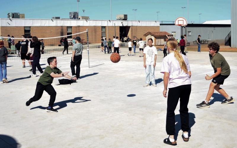 Meeker students play a variety of games on the school’s new Bulldog Square. Photo/Brian Blansett