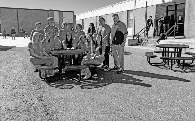 The Meeker Student Council along with school administration at one of the new tables east of the high school. Photo/Brian Blansett