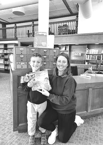 Megan and Knox smile in front of the Seed Library at Chandler Public Library. They picked out pollinator flower seeds based on Juniper’s Butterfly Garden book. Vegetable, flower and herb seeds with planting guides are available to all gardeners at the library. All seeds were donated by Lincoln County Farm Center and Friends of the Library. Photo/Sandy Tharp-Thee