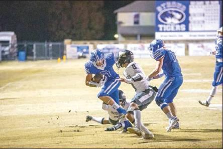 Drew Elerick tries to get around a Mounds defender. Photo/Tommie Marshall