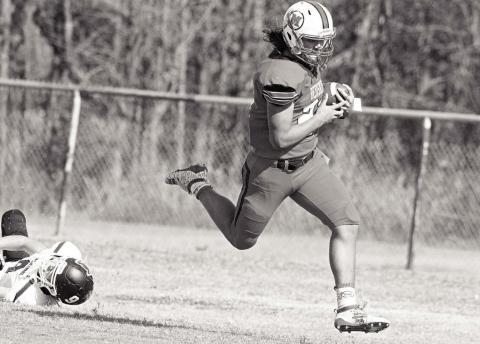 Clint Campbell leaves a would-be tackler in his wake as he sprints to a touchdown against Bridge Creek Saturday afternoon.