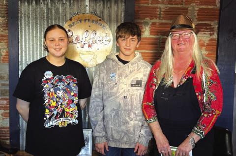 Kambyr Barrett (far left) and Karter Ericksen (middle), both of Chandler, placed first and fifth, respectively, in the Rural Oklahoma Museum of Poetry’s Rt. 66 Poem Contest. Makinlee Angin (not pictured) also placed second in the same contest. Photo/Pamela Anderson.
