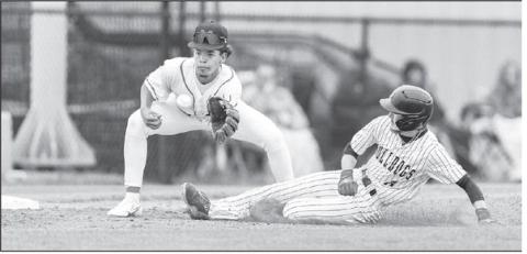 Meeker’s Jason Key slides safely into third against Morrison last week. Photo/Rick Hester