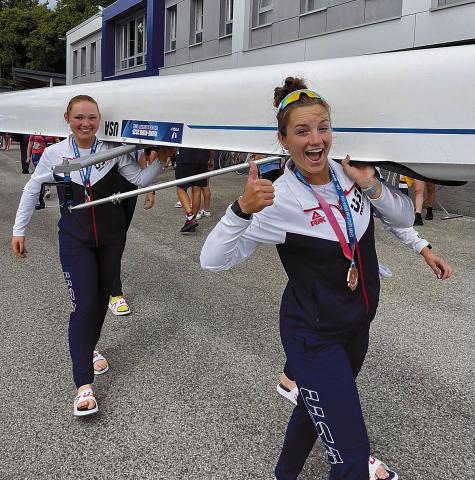 Leah Reeves (right, front) carries a boat with her teammate after receiving the bronze medal in the women’s 8+ rowing competition at the 2025 FISUWorld University Games in Germany. The team came in behind Great Britain and the Netherlands. Reeves is a Chandler graduate from the Class of 2022. Photo Submitted/Billie Rae Brannon