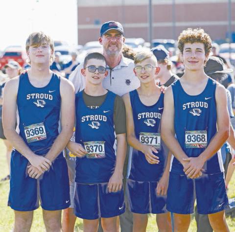 Oklahoma Gov. Kevin Stitt was in Stroud Saturday to watch his son, Remy, run for Oklahoma Christian School in the annual cross country meet. After spectating, he graciously posed for a photo with the Stroud boys cross country team, from left, Bobby Mitchell, Rylan McCracken, Jaymin Ashpaugh and Aiden Young. Photo/Beth Young